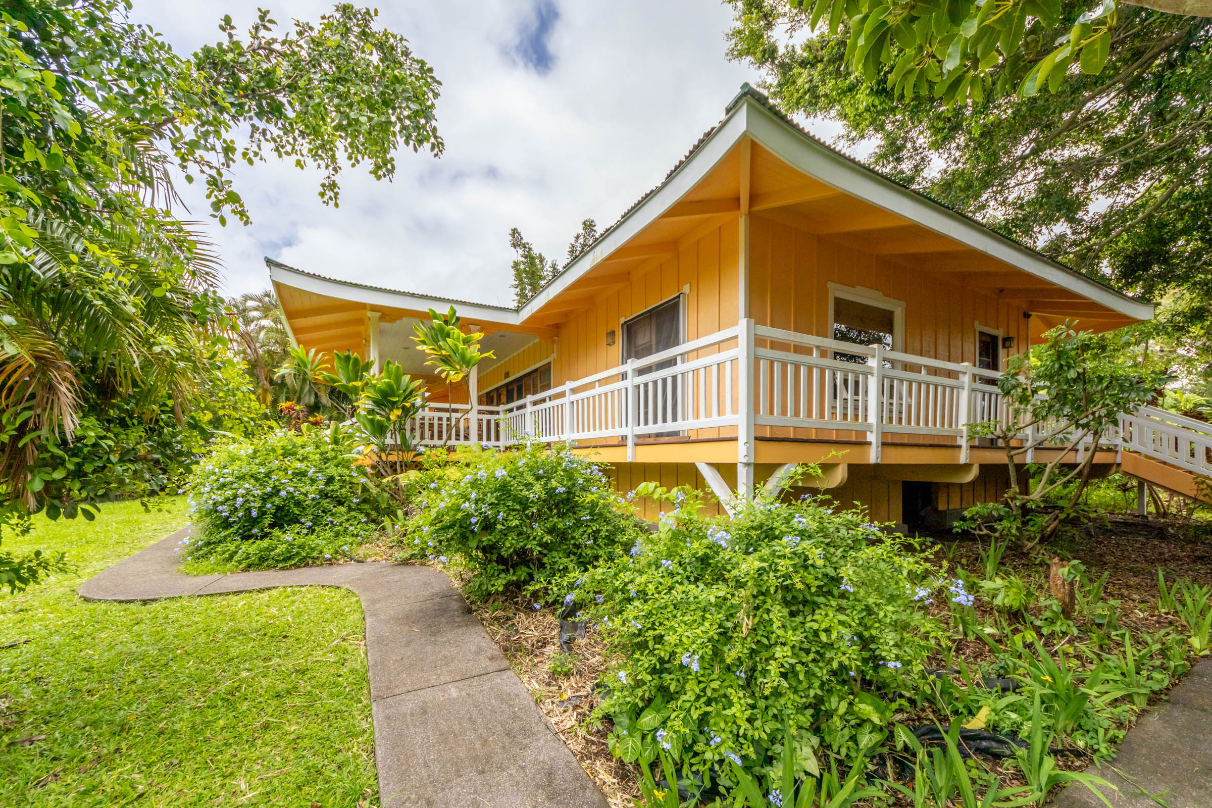 Covered porches and garden paths beside the residence